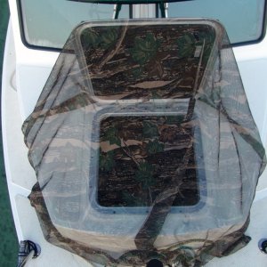 This is a bug net that I made. A simple fabric screen with a galvanized chain sewn in the border to keep it down