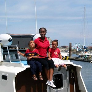 (Aiviq) Wife and kids on the sun deck.  New bombard dingy on pilothouse roof