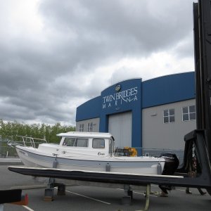 Media '2017-04-18 Setting boat onto work stand to remove the straps, then it will be lifted onto storage rack inside the building' in album 'Time for 100 hour service at 9 months, just in time for the "boating season" LOL.'