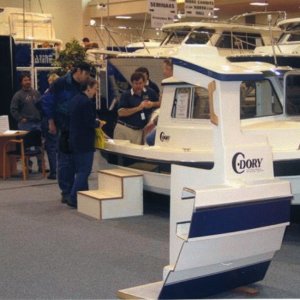 Jan 2003 Joe (in boat) Les (EQ Marine), Ruth & youngest son (blue jacket) at Seattle Boat Show