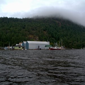 Entering Genoa Bay. We would hike up to the top of that hill on the following day, all the way to the top which is hidden under clouds in this photo.