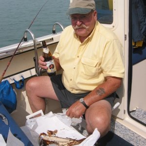 Good Friend and fishing buddy Ira. Excellent weather, calm water, imported German weiss beer, smoked whitefish for lunch, fresh herring in the cooler - Life is great!