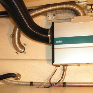 (Dora~Jean) Intake/exhaust hose and inside cabin hot air duct. Note fabbed insulating plate for intake/exhaust hose, it is spaced 1/4" on top from fiberglass.