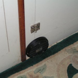 (Dora~Jean) Cold air return register, fixed vanes angled downward.
