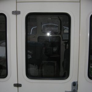 The pilothouse door of a CD-22 as seen from outside on the back deck.