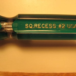 Size of driver you need for these screws.      

Also called a Robertson head, I think.