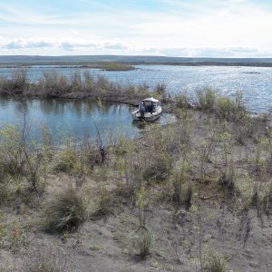 Media 'It is difficult to go ashore because most of what shows as islands on the chart is patches of marsh vegetation.  This one had a sand bar with a really deep pool.  Sat on the hill and watched stuff through the binoculars.  Forgot about taking pictures.' in album 'Off to the Potholes.  This is driving past Soap Lake.'