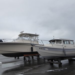 Back at the marina washing down. 33' Grady on next stand.
