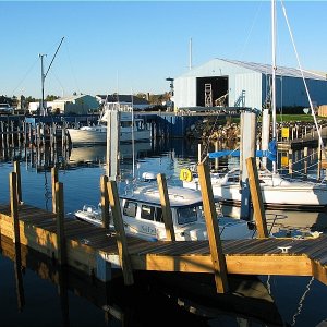 Mackinac City Harbor a few floating docks most dock too high many boats being pulled in Sept