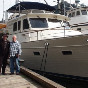 With Tony Fleming, designer of the the Fleming Yacht line in front of his first Fleming Yacht, which he still owns & cruises, the 65 foot Venture