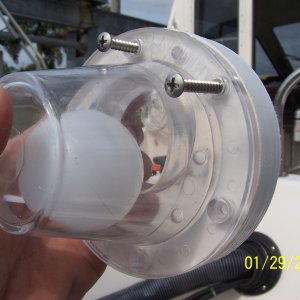 Media 'The scupper has a rectangle hole in it that goes down and the gasket that goes between the scupper and the spacer has a hole in it that the ball seats in and that hole goes up.' in album 'The old rubber flappers had warped allowing water back into the cockpit area, so I decided to replace them with Rabud ball scuppers.'