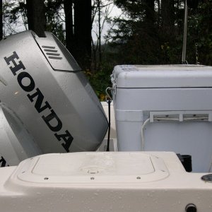 Image showing cooler in relationship to engines in maximum up-position.  Note placement of cutting board on top of cooler for bait cutting.
