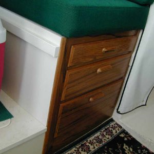 Drawers under the front seat.