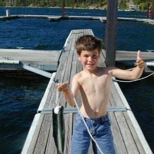 Mason (7 yearsJ) showing off fish from Lake Chelan, 2003.