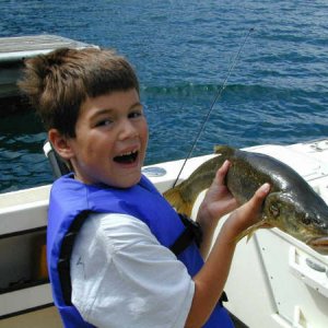 Mason with trophy squaw fish, Lake Chelan, 2003.