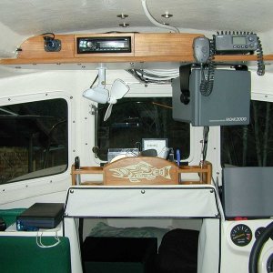 Helm layout, extra 12 volt plug upper left for my son's laptop for playing movies.  Center console for CD storage, beverages, tide books, pens, etc. (Mason C. Bailey)
