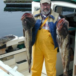 (Mason C. Bailey) Neah Bay Trip 5/10/05
Jim with 2 more nice Lings from 72 square.  I think I need to enlarge my fish cleaning station or at least make a larger one for the starboard side.