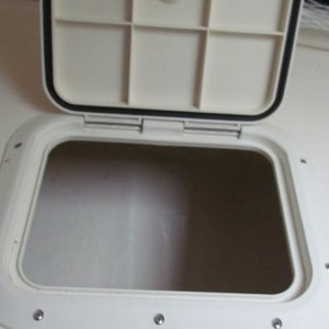 Media 'factory installed storage hatch under the v berth' in album 'the smaller hatch on the port side is where my wife stores her clothes and starboard side is where I keep my clothes.Black spots are velcro for trying to keep cushions in place'