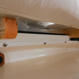 Media 'Here are the hooks in the feet firmly connected to the window frame.' in album 'The first thing I did was epoxy some "feet" on the bottom of the AC.  There are "hooks" cut into the feet to sit on the window frame.  These are glued down with 5200.'