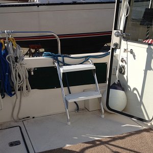 Media 'I installed Garelick cockpit steps that will mostly serve the port coaming (the side against the dock). But I also installed brackets on the starboard side -- in case. They are much easier to use than the built-in step.' in album 'It was easier to work on Muse at ground level in our favorite boat yard.'