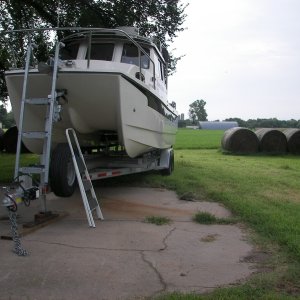 The trailer comes with the electric over hydraulic wire connections mounted in a box TOO LOW to the water!