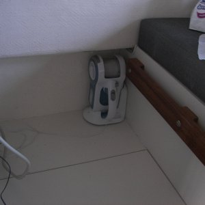 The Larger Dust Buster and charger fits well under dinette and is a pretty powerful vacuum.