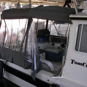Magma Newport grill fits under rear windows and can be used by zipping windows out.