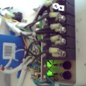 Back of AC power panel.  After 8 hours on shore power with no problems I noticed sparks then no AC juice.  Upon close inspection, the wire between the reverse polarity switch and the main bus board was cooked.