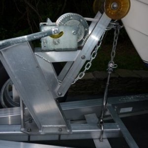 P1000486 Some scrap 3 x 4" aluminum angle 1/2" stainless u-bolt 35 dollar stainless turnbuckle, short piece of chain, and a shackle.