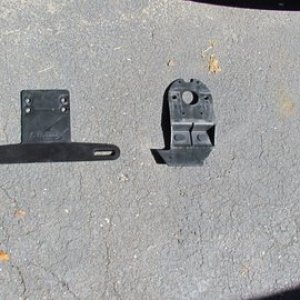 the standard plastic license plate holder failed unit on right $1.99 replacement from Defender on left