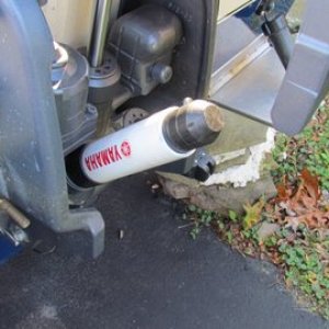 Media 'Just slid down over tilt rod. On our 150 hp motor there is a grease fitting that can interfere so we always use the port tilt rod' in album 'P1000486 Some scrap 3 x 4" aluminum angle 1/2" stainless u-bolt 35 dollar stainless turnbuckle, short piece of chain, and a shackle.'