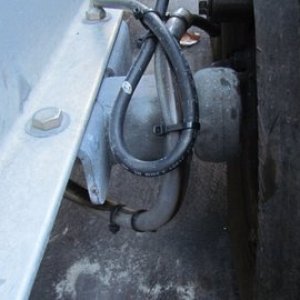 Media 'More protective tubing to protect brake lines' in album 'P1000486 Some scrap 3 x 4" aluminum angle 1/2" stainless u-bolt 35 dollar stainless turnbuckle, short piece of chain, and a shackle.'