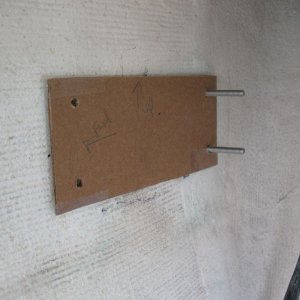 Cardboard template used for mounting the Weld Mount studs to the hull side.  The two aft ones (that are already there) are longer, and the two forward ones (not there yet in photo) will be shorter to make it easier to get the yellow plate back in after removing it.