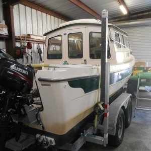 Media 'Heavy duty vertical guides.  These won't bend.  Wind, waves, current no problem.  Steer the bow between these guides, steer the stern around, and power up to the winch.  They solved my loading problems.' in album 'Added a second axle to trailer.  Boat came with one 3500 lb axle.  That seemed to light for the job.'