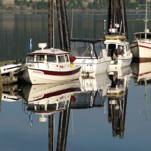 "SleepyC" and Friends at Mystery Bay SP 2009. Julie Anne, JC Lately, and a nice old wooden C-Dory wanna-beon a quiet warm morning.