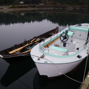 This 19 Bartender was built by George Calkins, original designer of the Bartender in the late 50's.  Found this (white and green) one with the bow nearly submerged, bowdown, and stern in the air, water up to the seat part of the console, tied to a sunken mooring ball one morning in Mystery Bay. (See the 360 tour view below.)