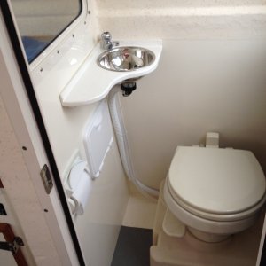 Adding a small sink in Head improves cruising comfort and convenience for crew and really does not cramp Tomcat head