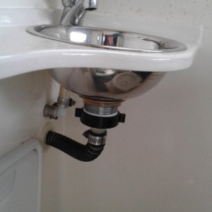 Running sink lines to under galley cleans up head area