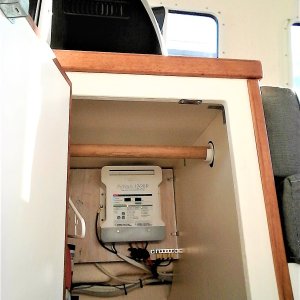 Mounting a state of the art ProNautic 1220P Charger high in hanging closet makes monitoring easy and out of the way of original under seat storage area