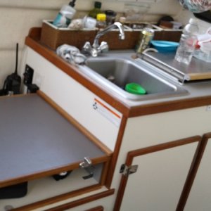 Additional counter space under helm seat