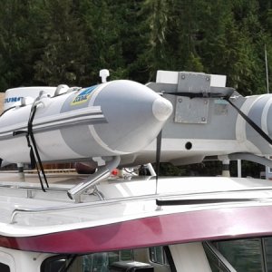 Light weight PVC/Conduit dingy mount is removable, makes mounting easy and keeps tender from scraping your cabin top.