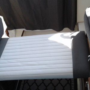 A simple extra Seat pad can be used as extra seat for kids or dog or just a place to stretch your legs out, turn it over to a non padded size give more working space for the galley.