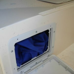 I removed the water tank from under the dinette seat and replaced it with a fabric "bag" tank under the port V berth.  Water suppy is from the same filler cap, but now a longer hose runs along the side of the hull, thru the front dinette seat to the tank location.  From there a smaller line goes to the foot pump.  Later edit=, bag leaked so went with a smaller hard tank of about 12 gallons.