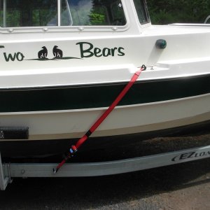 It seems to me most boats are inadequately tied down to trailer.  I'm the 3rd owner, and the boat came to me with three tie downs: 1) the bow chain to the winch and two tired straps on the back that went to the frame.  They kept the boat from sliding off the trailer, but the only thing keeping the boat from going forward in a sudden (or worse) stop was the winch post.  I added a ring to the frame and add two winch straps to the center of the boat that should keep it going forward very far.