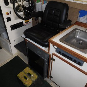 Helm Seat turned to aisle is used for extra seating when guests visit for Dock Tails.
Foot support is an RV step which is normally allows stepping from swim step.