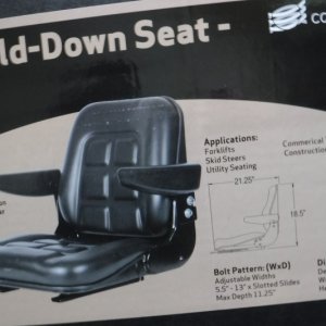 Tractor seat box.  Seat slides forward to lower back flat.  I'm 6' & 200 lbs & have always had trouble getting legs under wheel.  This is no different, but much more comfortable for extended periods.