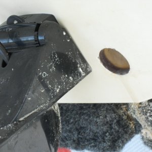 Media '1" hole in Stbd. transom. Slightly R. of center due to Triducer.' in album '1" cores cut from transom. Closed cell foam core. Garboard flanges and plugs. Orange plugs are emergency spares.'