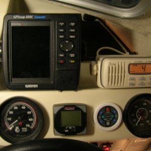 Garmin 188C, decent VHF, Tach, Speedo, digital motor guage, and remote radio control all at helm. This is how she came. no need to change anything here now.
