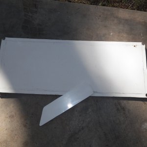 This is the scrap fiberglass from the cut outs that I did for the heater.  That is what I use to make panels for little projects.  The little piece is going to be a cover for a reading light that I am adding to the V berth.