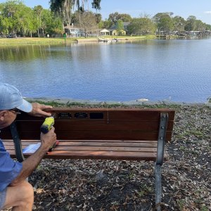 Tom installing memorial plague for Larry Krabach
